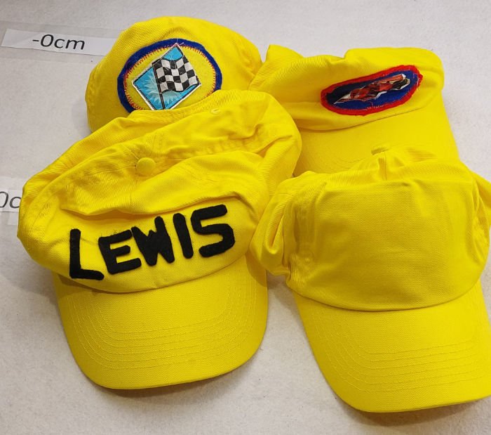 YELLOW CAPS WITH LOGOS